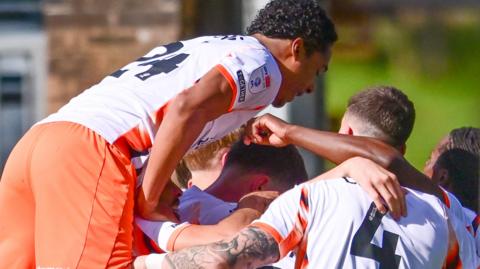Blackpool players celebrate a goal