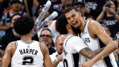 Julian Champagnie hugs Victor Wembanyama during the San Antonio Spurs' win over the Portland Trail Blazers in game four of their 2026 NBA play-off series