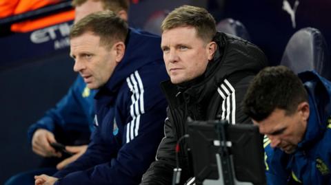 Eddie Howe sits in the Newcastle dugout