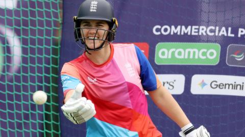 Nat Sciver-Brunt smiles during training