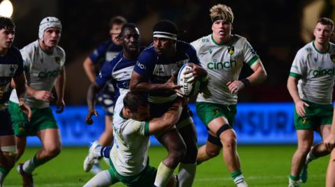 Kalaveti Ravouvou holds the ball under a tackle