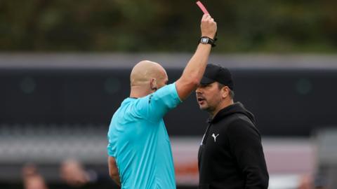 Stephen Clemence (right) being sent off by referee Daniel Middleton