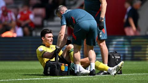Wrexham striker Kieffer Moore receives treatment