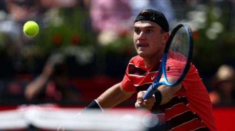 Jack Draper plays a shot