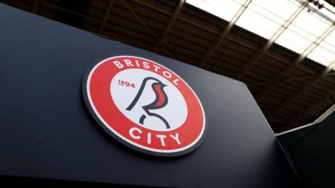 Bristol City's club badge inside Ashton Gate stadium on a wall