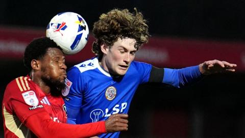 Salford City's Adebola Oluwo (left) and Bromley's Ben Krauhaus battle for the ball 