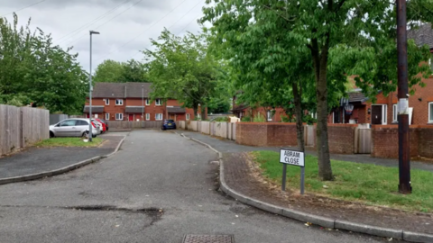 Street view shot of Abram Close where the items were found last weekend. A road leads into a cul-de-sac where houses surround it.