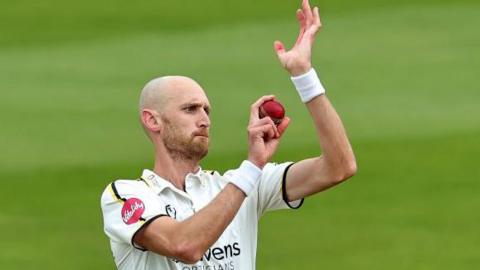 Olly Hannon Dalby bowls a ball during a match