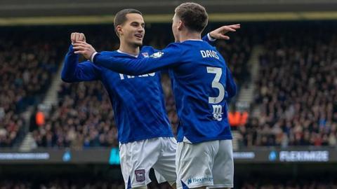 Anis Mehmeti celebrates with Leif Davis