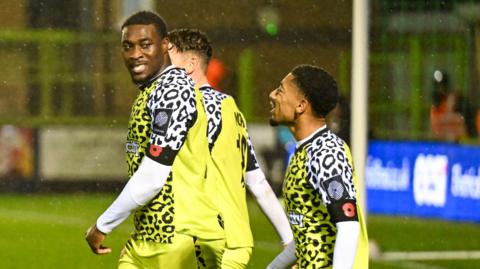 Forest Green Rovers' Temi Babalola (left)