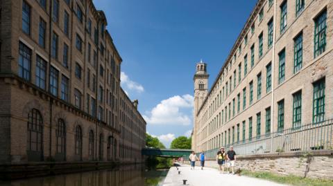 The canal running alongside Salt's Mill in Saltaire