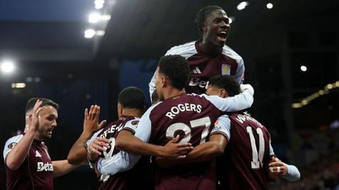 Aston Villa players celebrate a goal