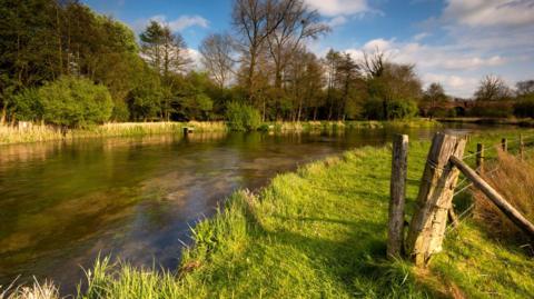 A stretch of the chalkstream river Itchen near Twyford, Hampshire, popular for trout fishing - stock photo