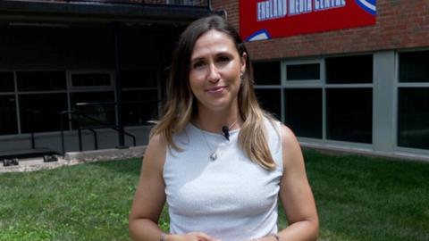 BBC Sport's Sarah Dawkins wearing a white, sleeveless top.