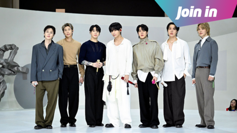 BTS posing in front of a white background with a pink and blue graphic in the top right hand corner that reads 'join in'