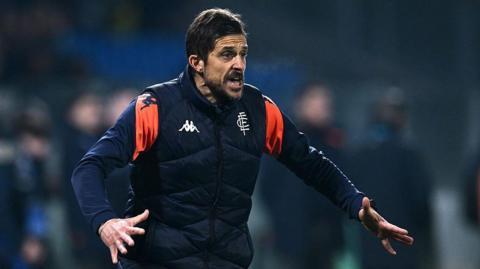 Alessio Dionisi pictured on the sidelines coaching Empoli in a dark blue training top