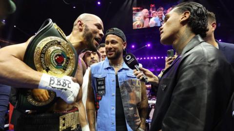 Chris Eubank Jr and Conor Benn face off in the ring with Neymar stood in the middle