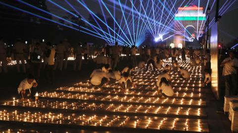 Rows of lighted candles in New Delhi.