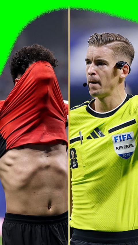 Mostafa Ziko lifts his shirt to celebrate scoring Egypt's second goal against Argentina while referee François Letexier looks on