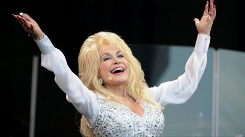 Dolly Parton is seen.