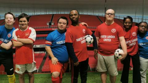 players from North London United pose for the cameras in their kit