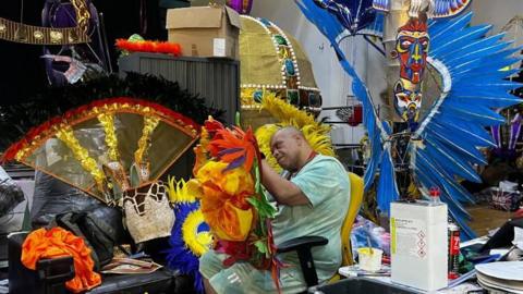 Steve Hoyte preparing costumes