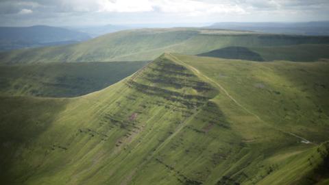 Photograph of the summit of Cribyn mountain as seen from Pen y Fan, Bannau Brycheiniog (Brecon Beacons National Park), Wales. 