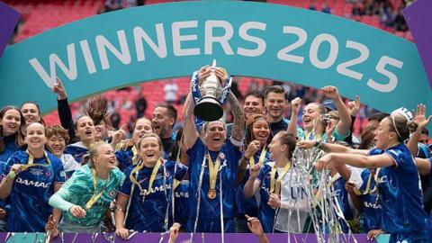 Chelsea captain Millie Bright (centre) lifts the Women's FA Cup trophy