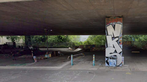 A Google Maps image of a skatepark, which is located in an underpass under the M32. There is graffiti on the concrete.