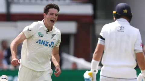 New Zealand fast bowler Will O'Rourke (left) celebrates taking the wicket of Englnad batter Joe Root (right)