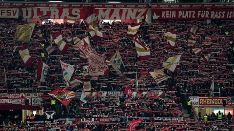 General view inside the stadium as fans display their scarves in the stands prior to the Bundesliga match between 1. FSV Mainz 05 and TSG Hoffenheim at MEWA Arena