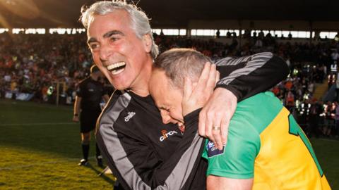 Donegal manager Jim McGuinness embraces Michael Murphy after the Ulster holders retained their title with a thrilling extra-time triumph