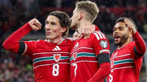 Harry Wilson (L), David Brooks (C) and Jay Dasilva (R) celebrate a goal