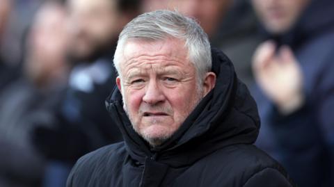 Chris Wilder standing on the touchline