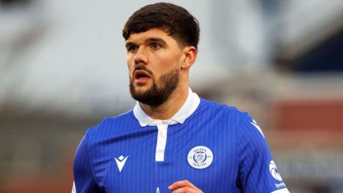 Queen of the South player Reece Lyon with a beard and dark hair