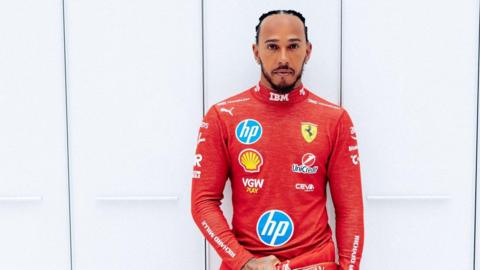 Lewis Hamilton wears the red Ferrari race suit for the first time 