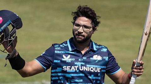 Yorkshire batsman Imam-ul-Haq acknowledges the crowd after scoring a century against Northamptonshire Steelbacks.