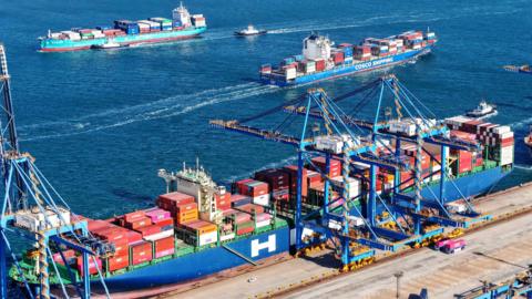 Container ships enter and exit the port of Qingdao, Shandong province, China, 3 February, 2025. 