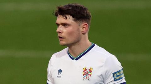 Defender Connor Woods on pitch during a Tranmere's game against Newport County