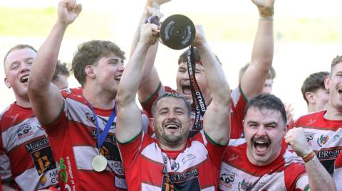 Lee Rees lifts the Super Rygbi Cymru trophy for Llandovery
