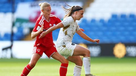 Katerina Kotrcova of Czech Republic (right) is challenged by Sophie Ingle of Wales 