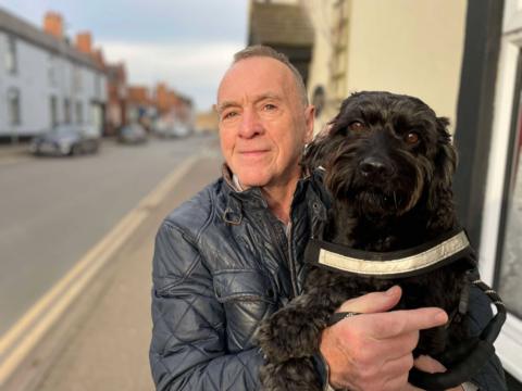 Man with dog on high street