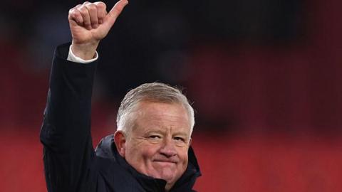 Sheffield United boss Chris Wilder salutes the travelling Blades fans at Stoke