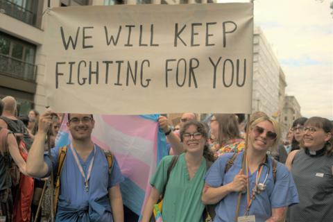 Healthcare workers join the parade showing their support