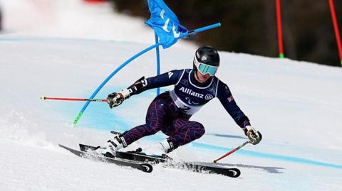 Skier Neil Simpson makes his way down the course on Friday