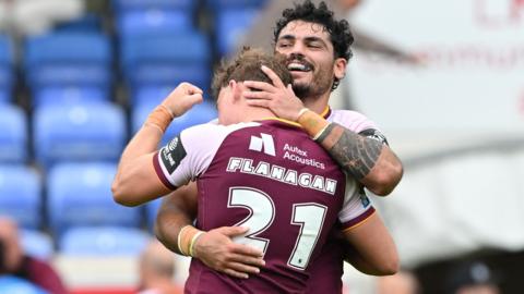 Huddersfield Giants players celebrate a victory