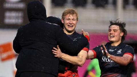 Nathan Michelow of Saracens celebrates scoring his team's fourth try during the Prem Rugby Cup match between Saracens and Newcastle Red Bulls at StoneX Stadium.