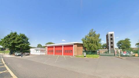 Fire station with blue skies above