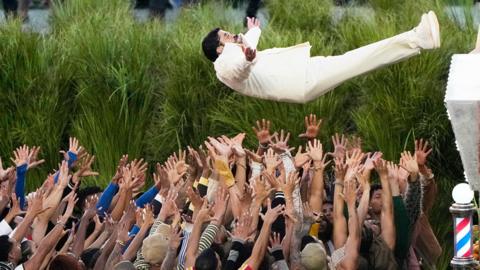 Bad Bunny stage dives during his performance at the 2026 Super Bowl halftime show