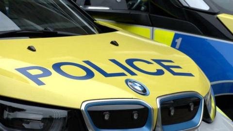 Jersey police car showing the yellow bonnet and the word 'Police'